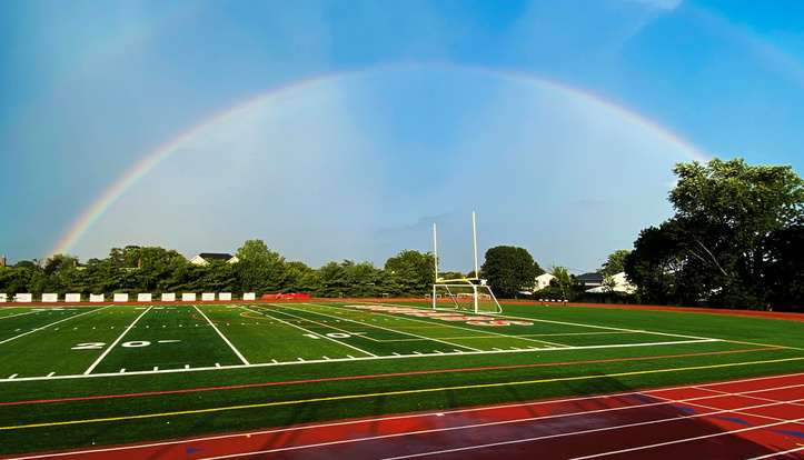 Rainbow over a high school athletic field